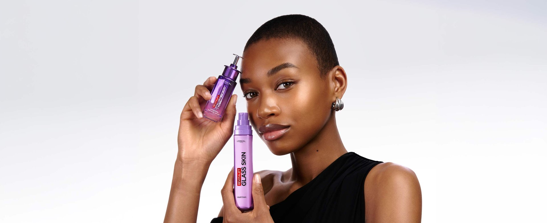 Topical skincare dropper applying clear vegan PDRN and multi-weight Hyaluronic Acid serum for anti-ageing, skin plumping, and glow.