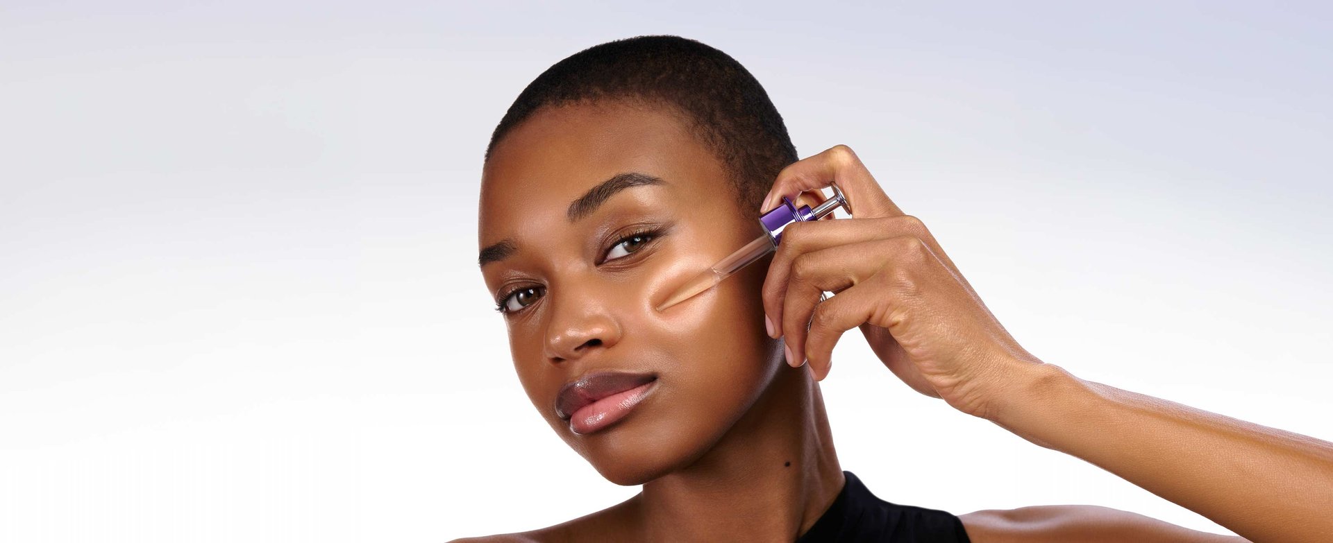 Close-up portrait of a woman showcasing smooth, plump, and radiant facial skin after using PDRN and hyaluronic acid serum.