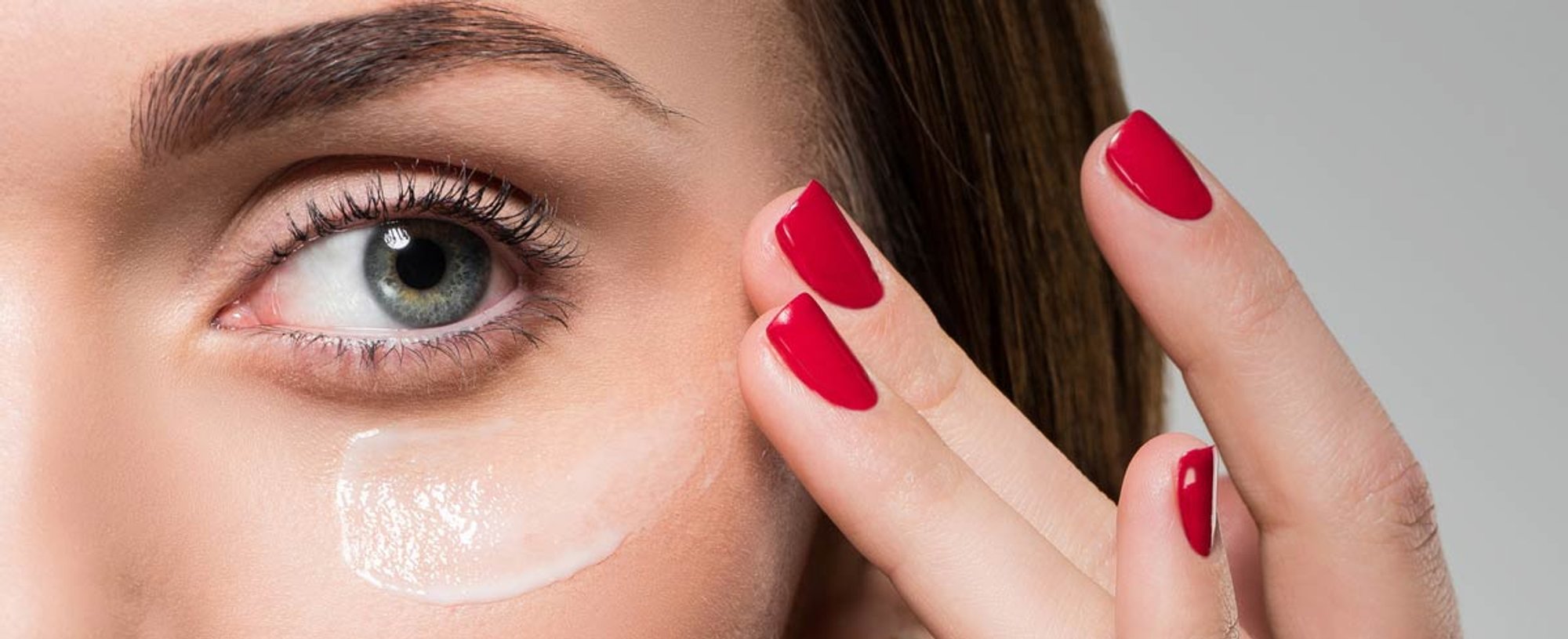 woman applying glycolic acid cream