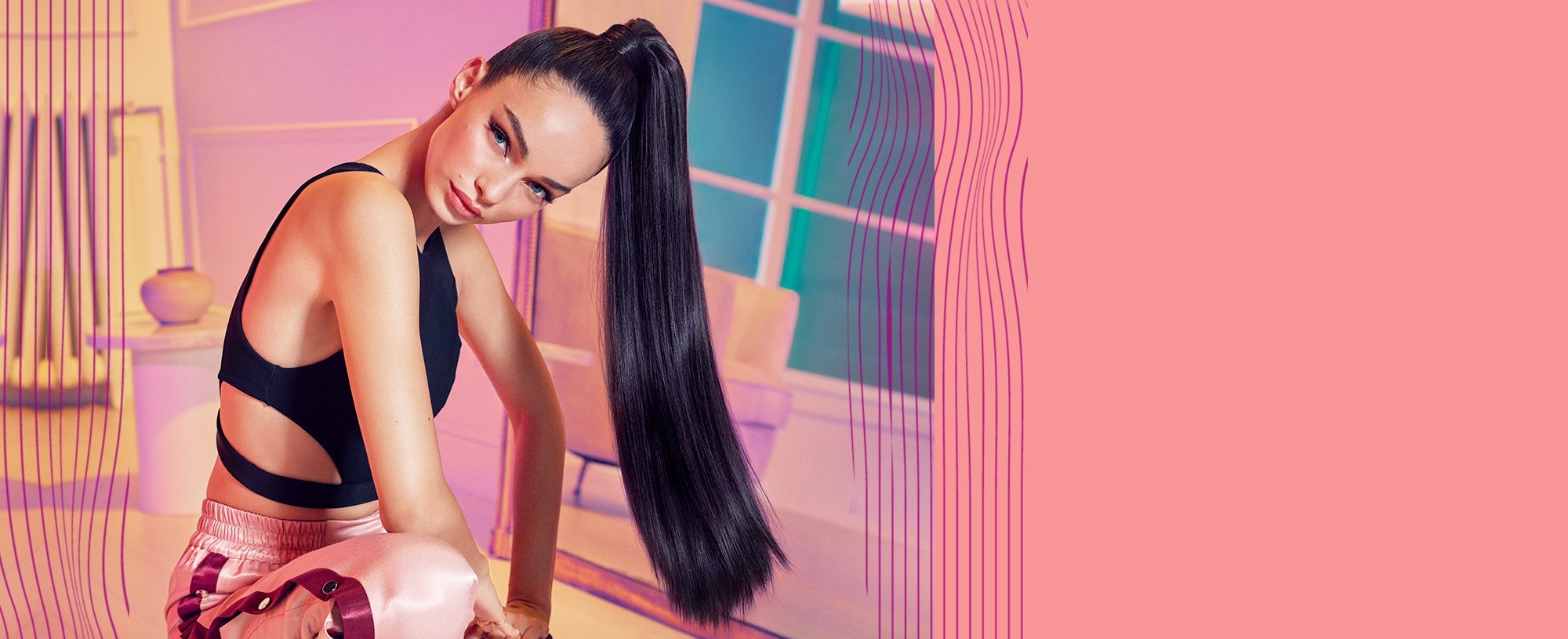 model with long black sleek hair in a ponytail